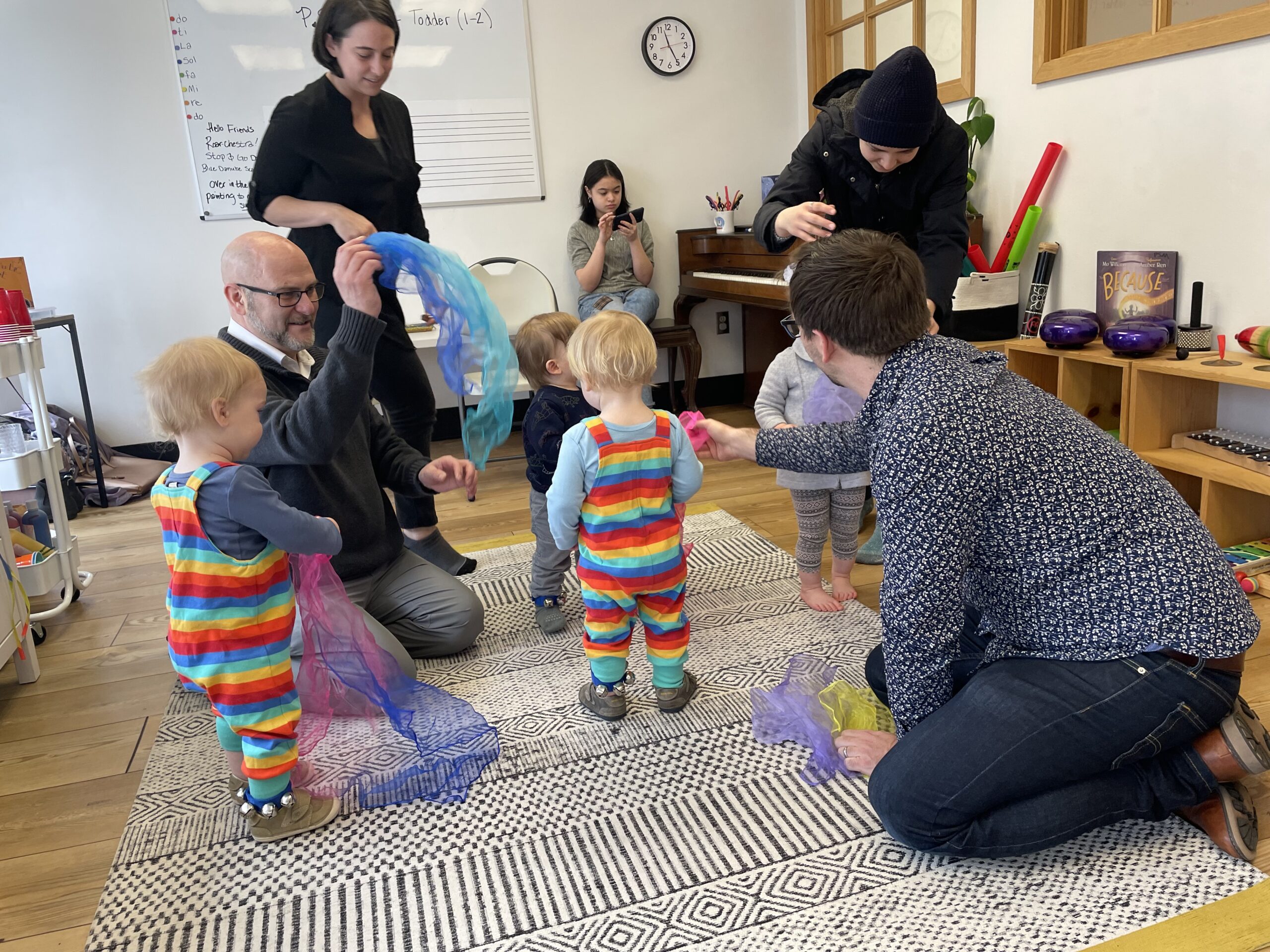 IMG_3383 toddlers dancing with teachers, parents, and scarves